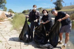 Denzil Vencencie, Bianca van der Mescht and Attie Higgs pictured cleaning up