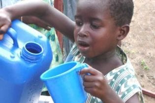 Child receiving water image