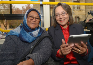 Mayor Patricia de Lille (right) with commuter Luthfia Frizlar (left) use the new Wi-Fi on a MyCiti bus