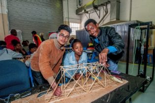 Jammy Francis (Alexander Road High School), Sinovuyo Mafu (Newton Tech High School) and Lubablo France (Gelvandale High School) testing the members of their warren truss bridge. Picture: SANRAL