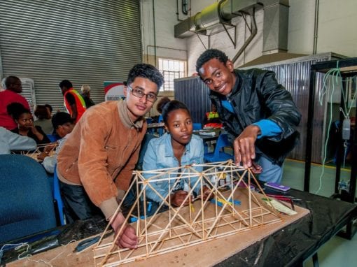 Jammy Francis (Alexander Road High School), Sinovuyo Mafu (Newton Tech High School) and Lubablo France (Gelvandale High School) testing the members of their warren truss bridge. Picture: SANRAL