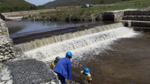 Teams employed by Gamtoos Irrigation Board construct concrete weirs and other structures to conserve degraded peat wetlands in the Kromme River system. Image: Supplied