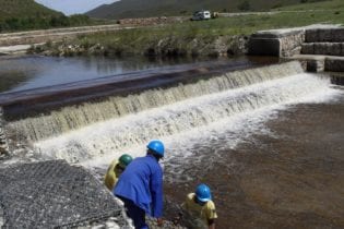 Teams employed by Gamtoos Irrigation Board construct concrete weirs and other structures to conserve degraded peat wetlands in the Kromme River system. Image: Supplied