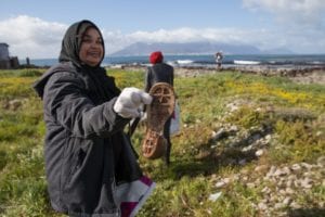 Volunteer Nadeema Peterson helping to clean up Robben Island