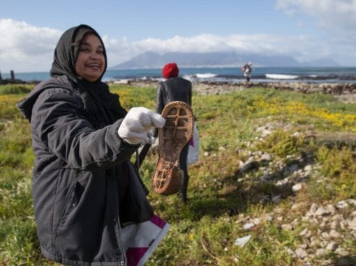 Volunteer Nadeema Peterson helping to clean up Robben Island