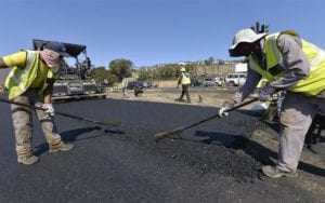 Placing asphalt layers on the newly constructed lanes along Kommetjie Road and Ou Kaapse Weg. Photo City of Cape Town