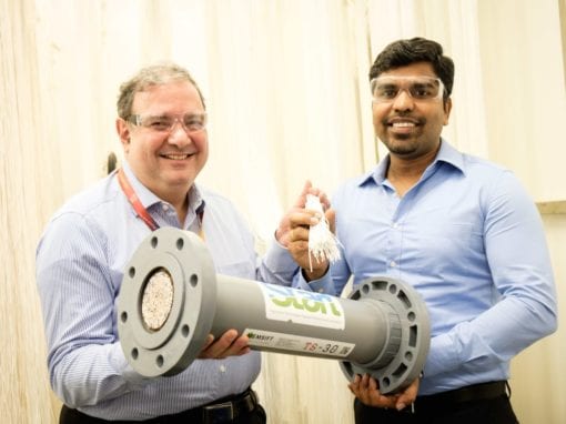 Dr Adil Dhalla (left), Managing Director of START Centre, holding the novel tri-bore hollow-fibre membrane, with Dr Antony Prince (right), Founder of Memsift Innovations, holding the completed membrane module to be used in the new pilot plant.