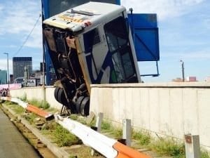 Bus is hanging on it's back wheels.  Image source: EWN Traffic