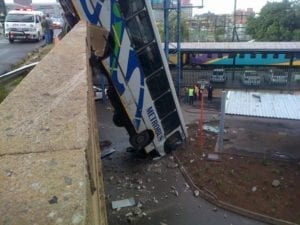 Bus hanging off bridge image