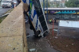 Bus hanging off bridge image