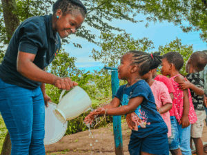 Early-Learning-Development-Vukuzenzele-Fun-Foundation-Grade-000-Washing-Hands-Using-Water-From-Thanda-Tank