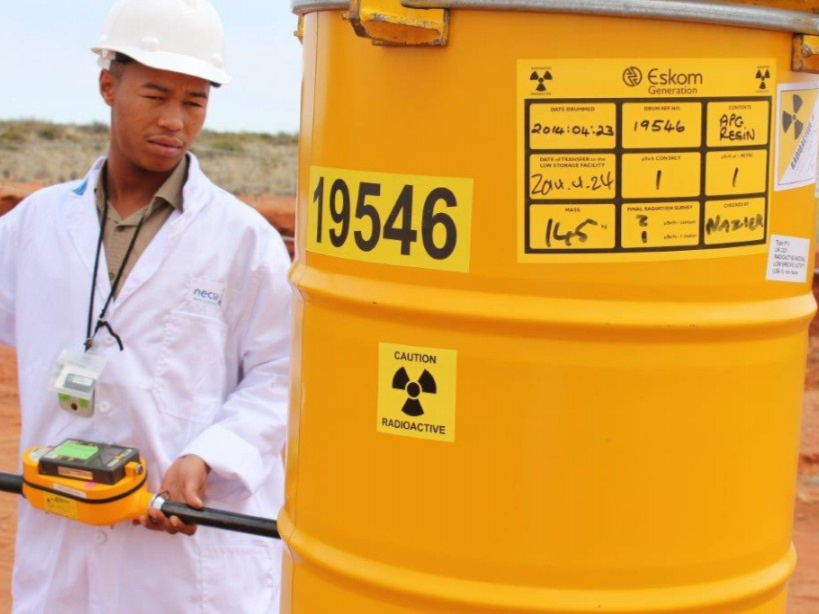 Steel drums being transported for trench burial nuclear waste dump sites