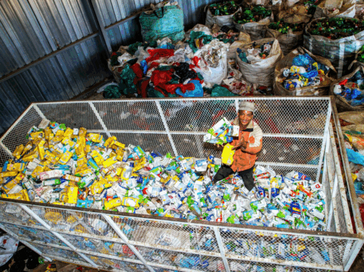 Koos Rapulane of Boikanyo Lesedi Environmental Waste Management surveys a mountain of liquid board cartons collected for recycling