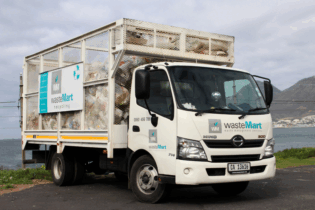 Waste Mart truck in Cape Town background for recycling