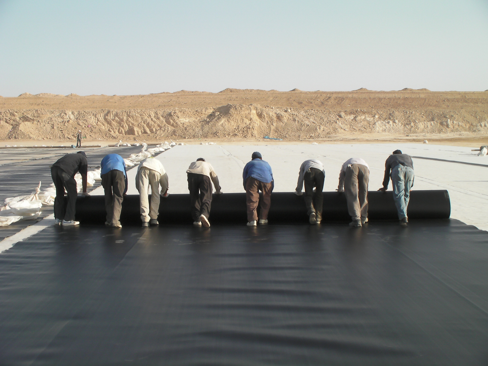 rolling out Geosynthetic linings