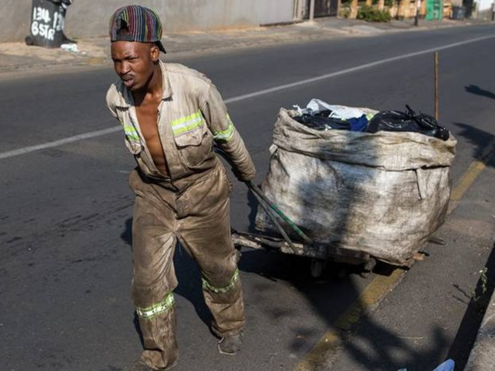 waste collectors digging for recycling