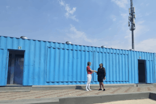 The Dignity Hub as a old container was refurbished and clad with recycled boards,