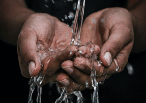 collecting water in cupped hands