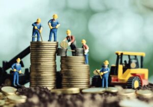 2026 Budget Speech related image with men building on coins