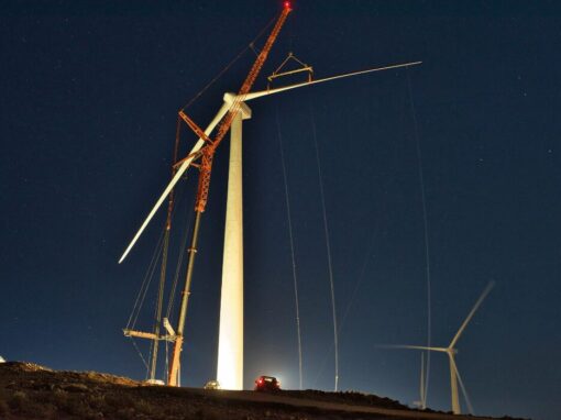 light in the night lighting up wind turbine