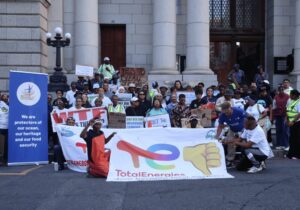 Small scale fishers and coastal community members gather outside the Western Cape High Court