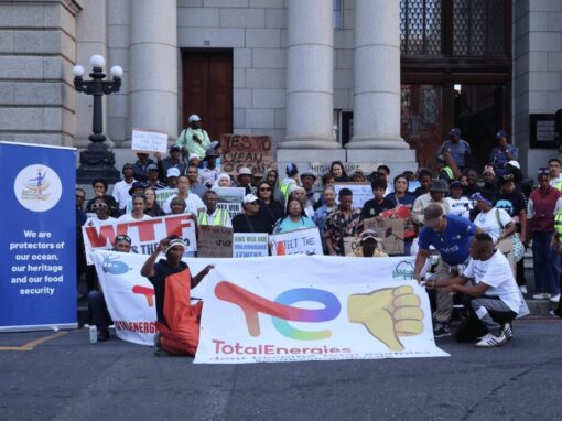 Small scale fishers and coastal community members gather outside the Western Cape High Court