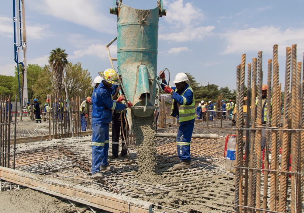 pouring concrete into a mold on a construction site