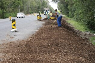 small contractor cleaning road mess