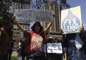Clean water for all sign during march