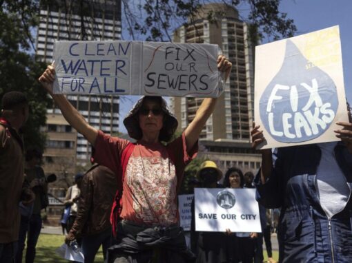 Clean water for all sign during march
