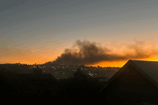 Kya Sands burning rubbish pile at night
