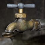 broken leaking tap water