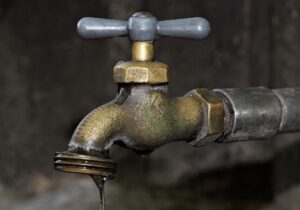 broken leaking tap water
