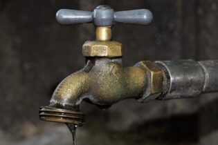 broken leaking tap water