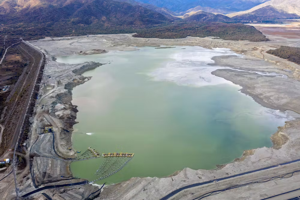 Copper-mining companies create huge tailings ponds, like this one in Chile in 2019, to store toxic byproducts of mining. Hundreds of these waste ponds exist across the country and carry the risk of leaking acidic water and heavy metals such as arsenic, copper and mercury into groundwater. Martin Bernetti/AFP via Getty Images