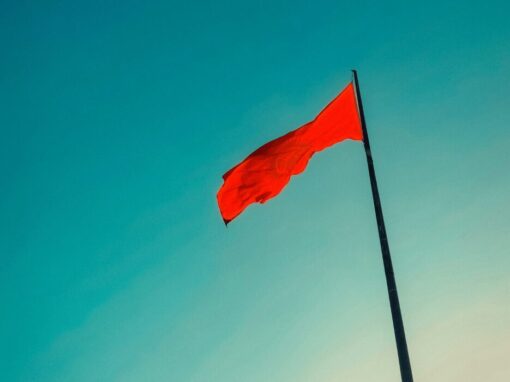 red flag warning against blue background