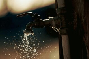South African water access for public with an open tap