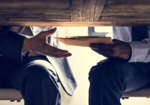 Under the table corruption and bribery package