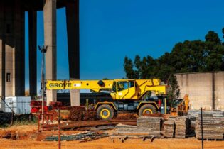 construction site with Grove machine and steel poles