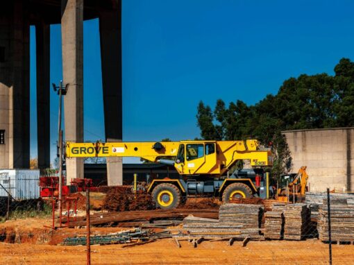 construction site with Grove machine and steel poles