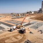 crane working on construction site at a mine