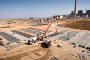 crane working on construction site at a mine