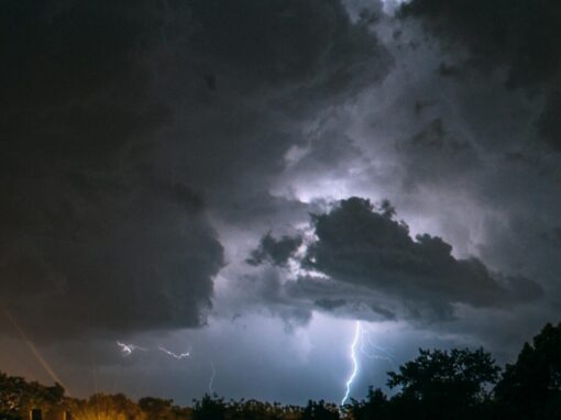 photo of lightning through a night sky