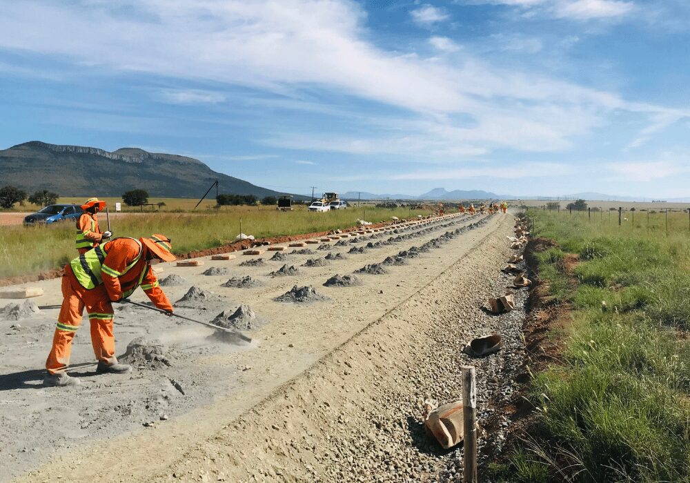road construction workers fixing a road