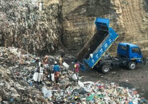 truck dumping waste into a landfill