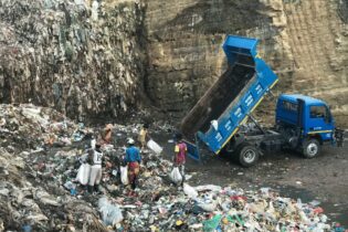 truck dumping waste into a landfill