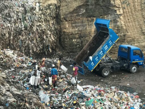 truck dumping waste into a landfill