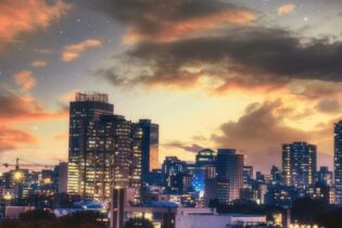 Johannesburg city centre at dusk with building lights on