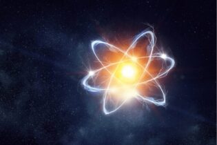 nuclear energy with glowing atom on a starry sky
