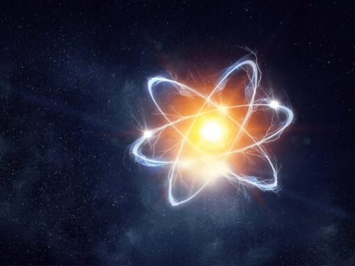 nuclear energy with glowing atom on a starry sky
